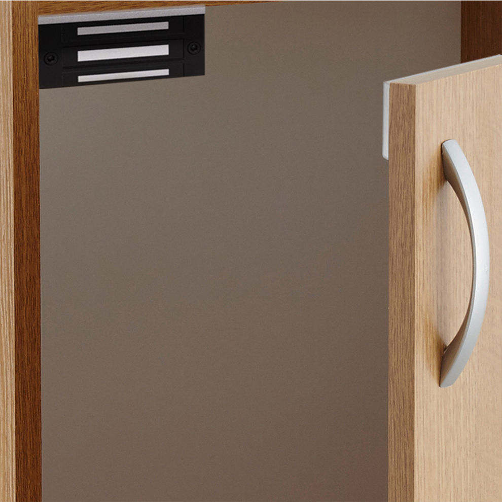 Mini electromagnetic lock installed on wooden cabinet door